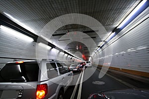 Car speeding and turning tunnel