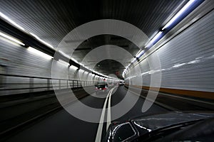 Car speeding and turning tunnel