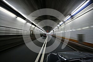 Car speeding and turning tunnel