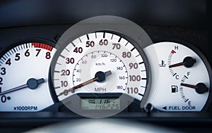 Car speedometer on dashboard