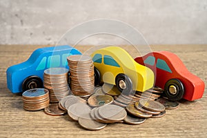 Car on stack of coins. Car loan, Finance, saving money, insurance and leasing time concepts