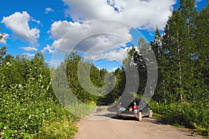 The car stands on a forest road