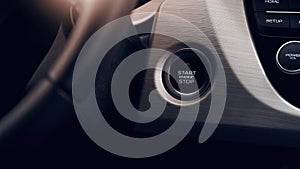 Car Start-Stop Engine Button of a modern car in the interior