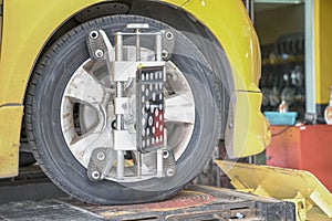 Car Steering Wheel Balancer Calibrate with laser reflector attach on each tire to center driving adjust