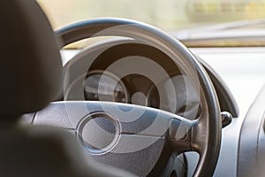 Car steering wheel. Interior view of the car