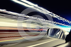 Car streaks of light in tunnel photo