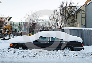 A Car stuck under snow, after snow storm