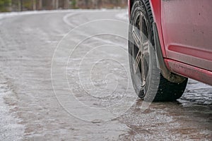 a car with studs on an icy road