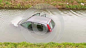 A car submerged in flood water, road accident