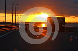 Car at sunset highway
