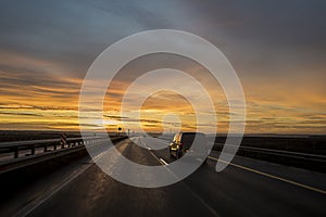 Car on the sunset road.