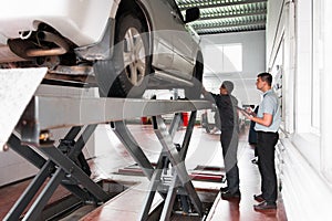 Car suspension system inspection at workshop