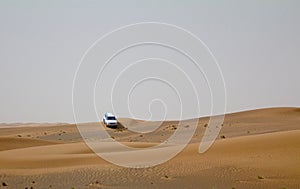 A car SUV off-roading in the deserts of Dubai, UAE