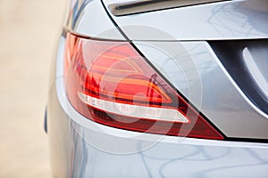 Car tail light on a sedan. close up