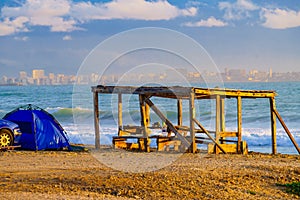 Car and tent on beach. Camping on seashore
