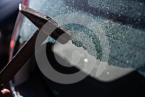 Car thief breaks the car window