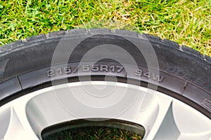 Car tire with aluminum rim.