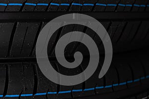 Car tire close up. Sport car tyre background. Car tyre texture.