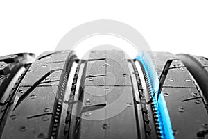 Car tire isolated on black background. Tire stack. Car tyre protector close up. Black rubber tire. Brand new car tires. Close up b