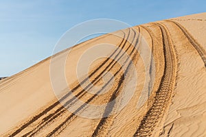 Car tire marks in the sand. car tracks. desert. more sand