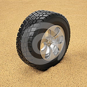 Car tire in the sand. Winter tires