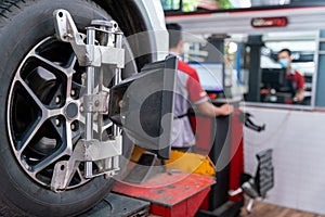 Car tire steering wheel balancing calibrate device for center adjust after tyre replace at car repair service center photo