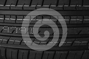 Car tire texture background. Black and white car tyre close up.