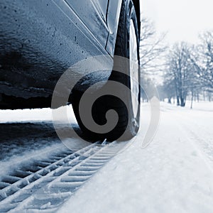 Car tire track in the snow. Concept for transport and winter tires in winter time