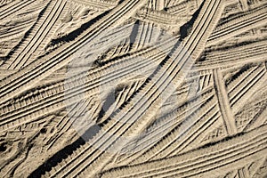 Car tire tracks in the sand