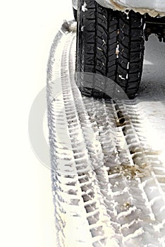 Car Tire and Tracks in Snow