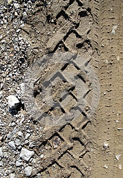 Car tire tracks on wet muddy trail royalty, road, abstract background, texture material. Tyre track on dirt sand or mud, retro