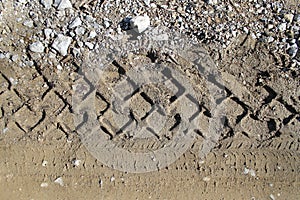 Car tire tracks on wet muddy trail royalty, road, abstract background, texture material. Tyre track on dirt sand or mud, retro