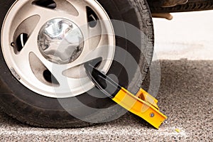 Car tire with yellow boot