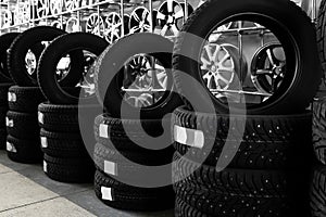 Car tires and alloy wheels in automobile center