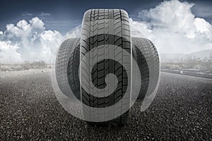 Car tires concept on a road