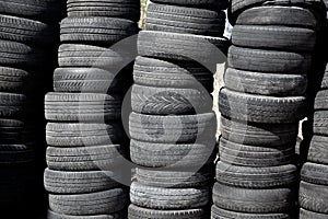 Car tires pneus stacked in rows