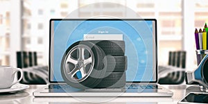 Car tires and rims on a laptop - office background. 3d illustration