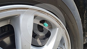 Car tires with wheels. One part of the car that needs to be checked regularly
