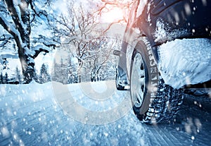 Car tires on winter road