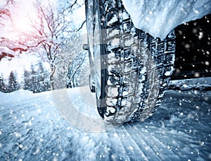 Car tires on winter road