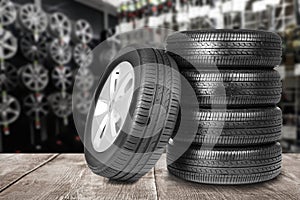 Car tires on wooden surface in auto store