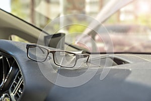 Car torpedo. driver glasses on a dashboard