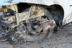 car totaly burnt up standing in rural site