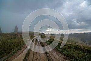 Car tour on mountains durring rainfall bad weather day