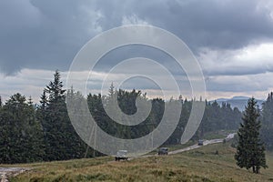 Car tour on mountains durring rainfall bad weather day photo