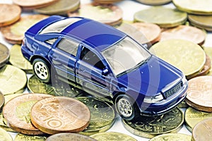 A car toy on banknotes as a concept of buying or renting a car