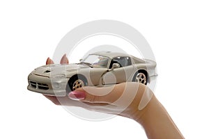 Car toy on palm