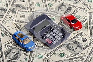 Car toys and calculator among the dollars