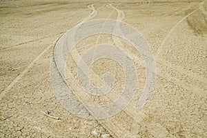 Car tracks on the sand