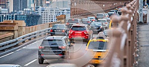 Car traffic entering a city bridge, business concept